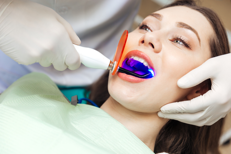 Close-up portrait of a female patient visiting dentist